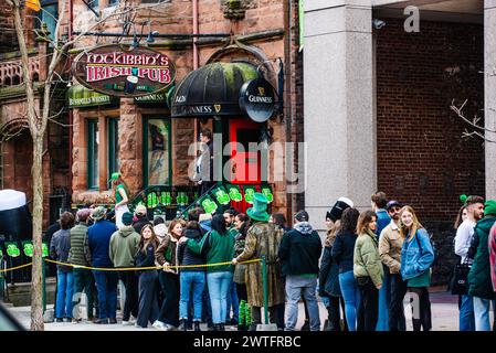 Montreal, Canada - March 17 2024： People celebrating the Saint Patrick`s Day Parade in Montreal downtown Stock Photo